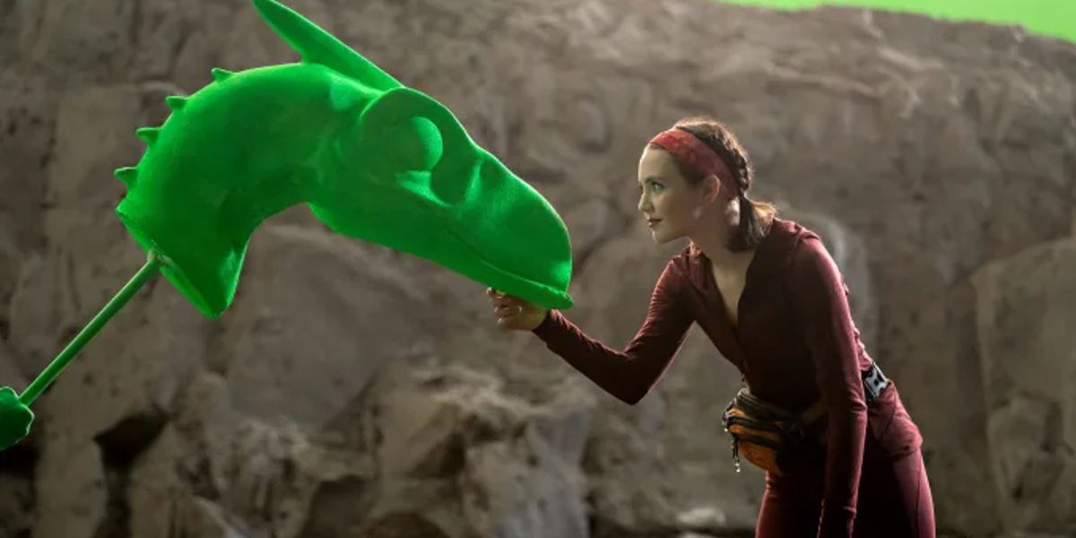 Krystal Kris training a baby dinosaur in The Bubble