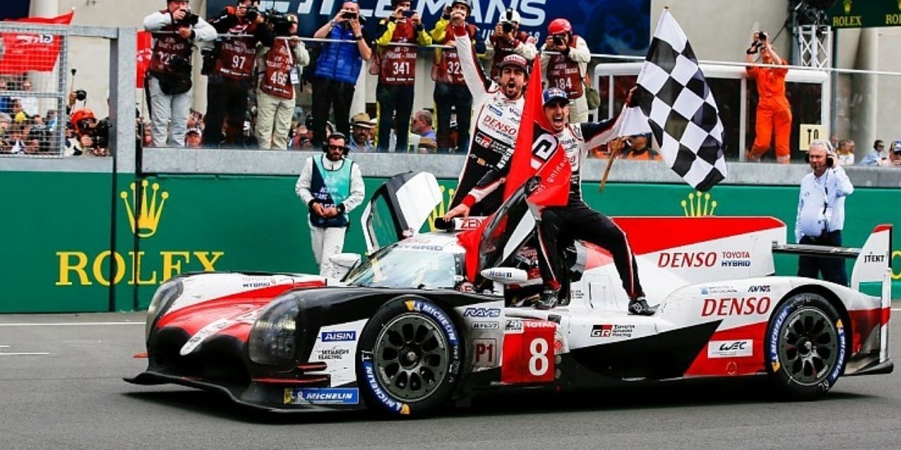 A driver celebrates his victory in Le Mans: Racing Is Everything