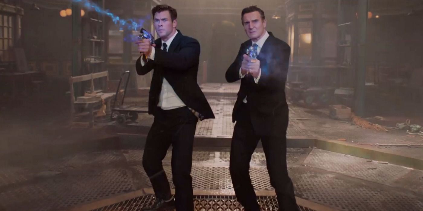 Liam Neeson and Chris Hemsworth fighting aliens in Men in Black.