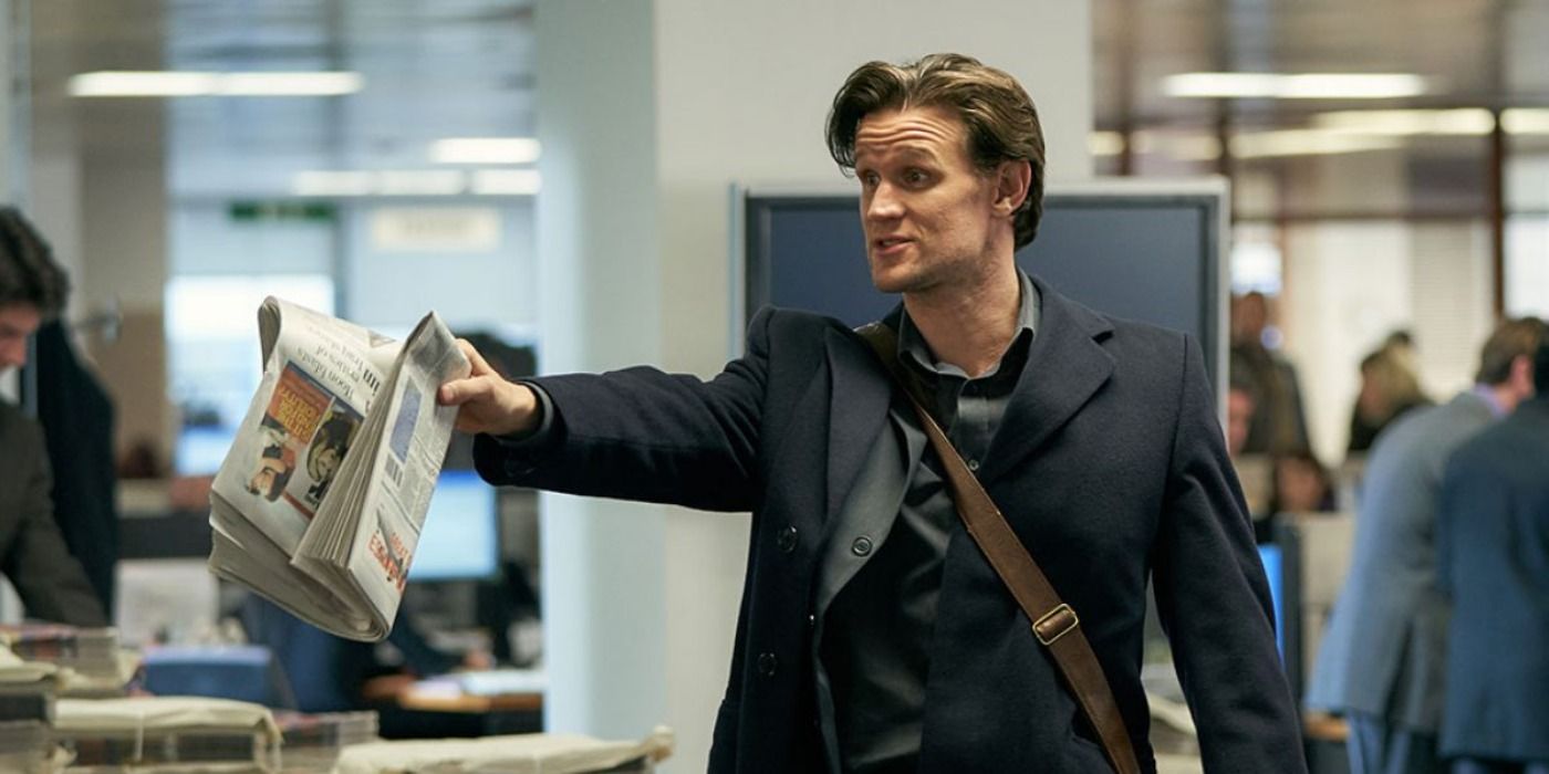 Matt Smith points with a newspaper in Official Secrets