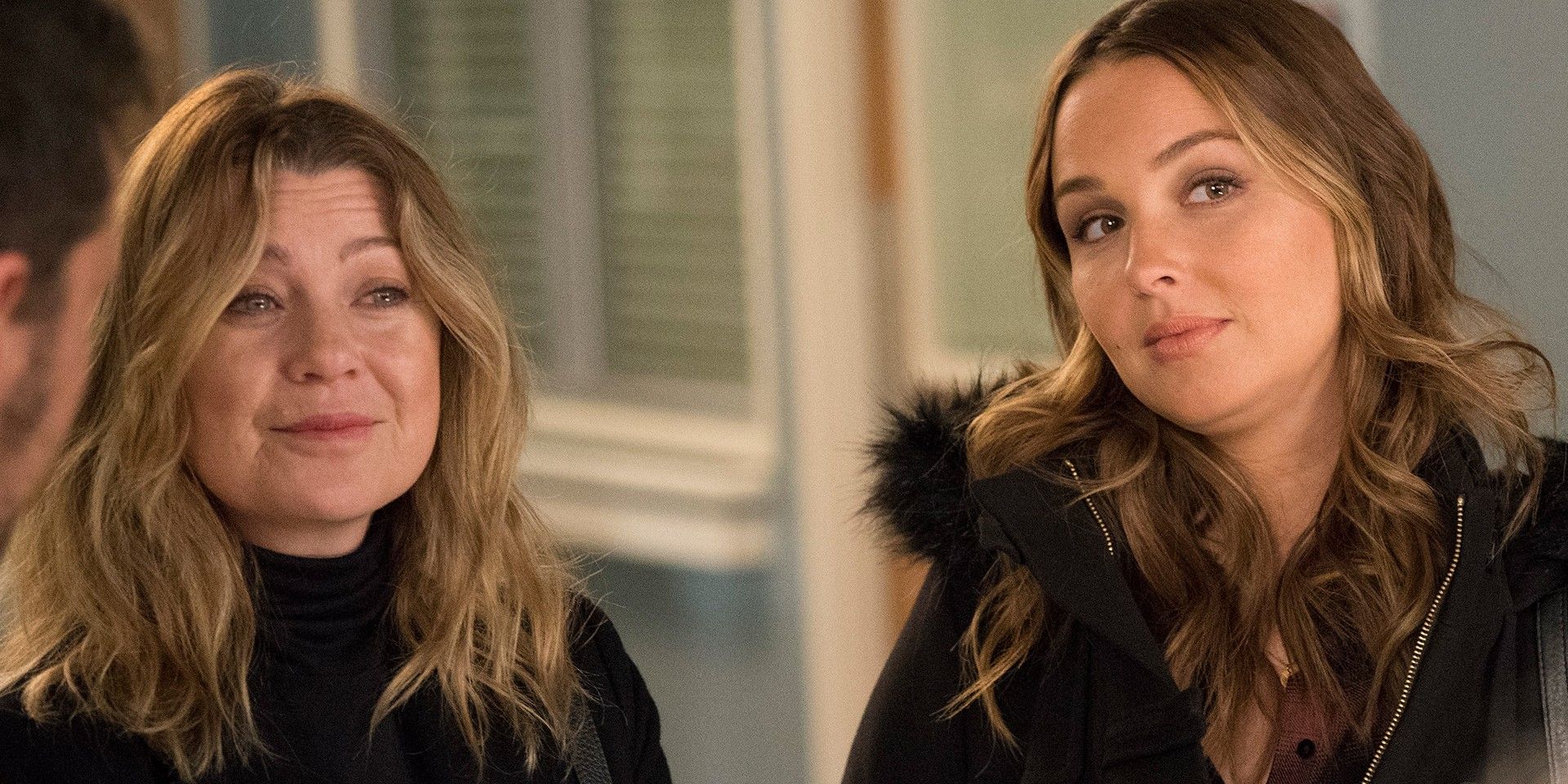 Meredith and Jo standing smiling in Grey&rsquo;s Anatomy