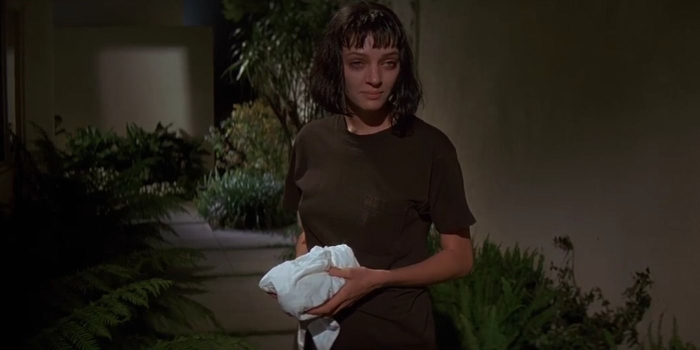 Mia Wallace stands in her lawn in Pulp Fiction