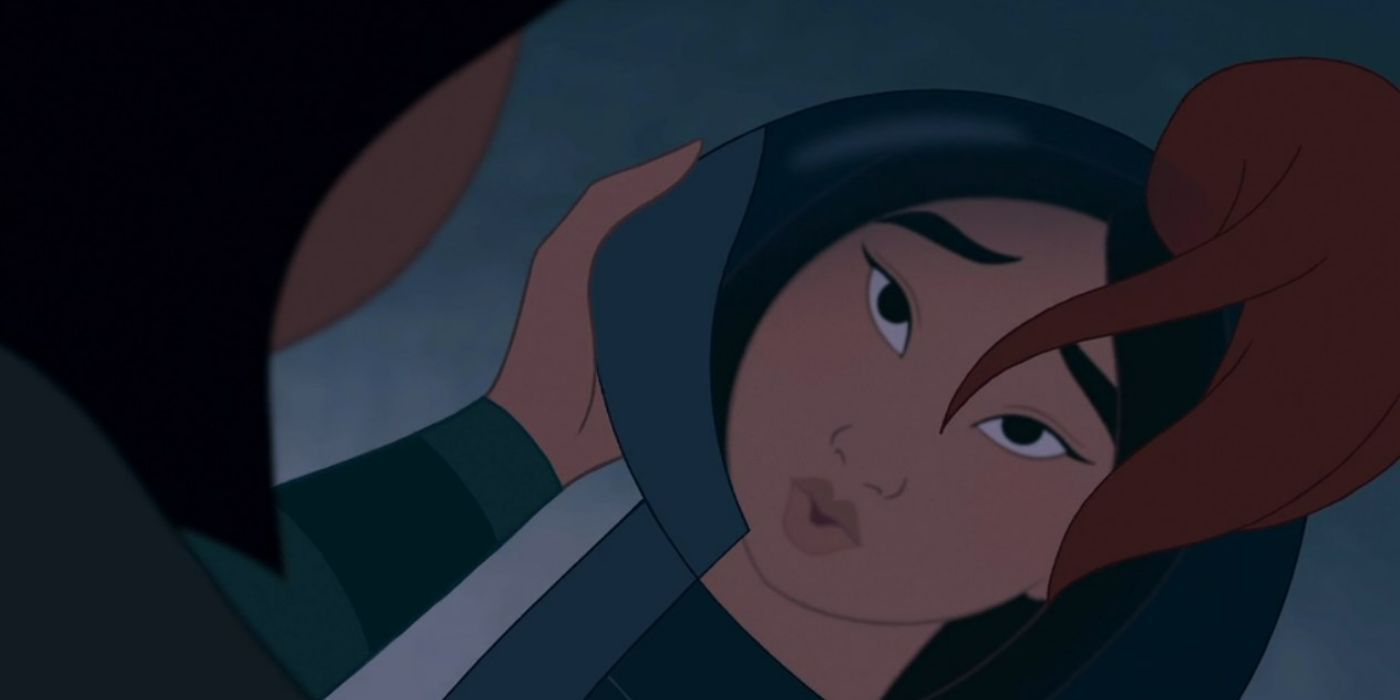 Mulan looking at her reflection in her helmet from Mulan 