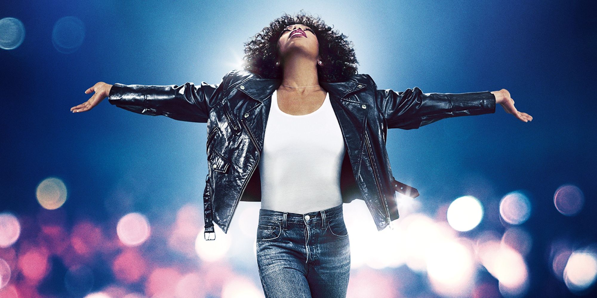 Whitney Houston spreading her arms and looking up in I Wanna Dance with Somebody.