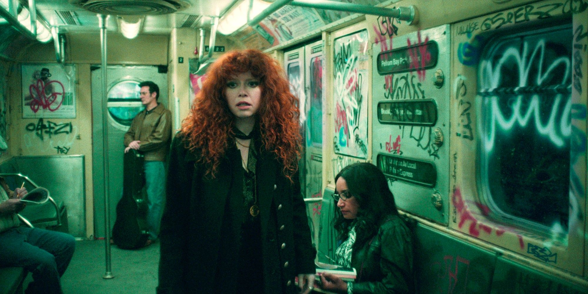 Natasha Lyonne in Russian Doll Season 2 stands in a subway