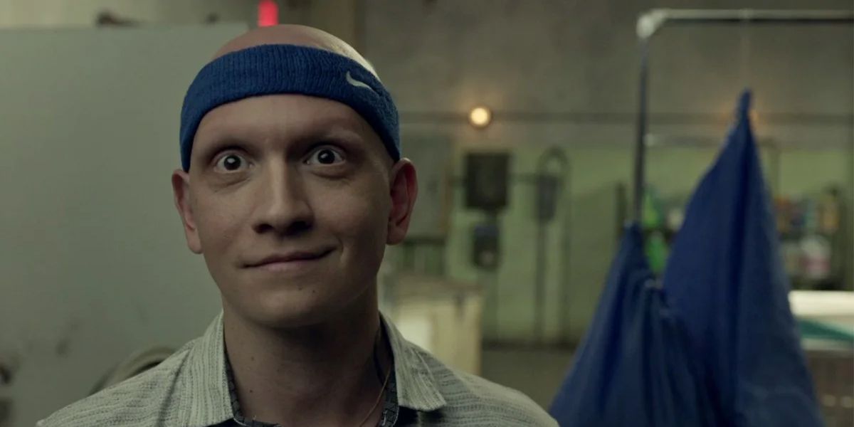 NoHo Hank (Anthony Carrigan) wearing a sweat band and smiling on Barry