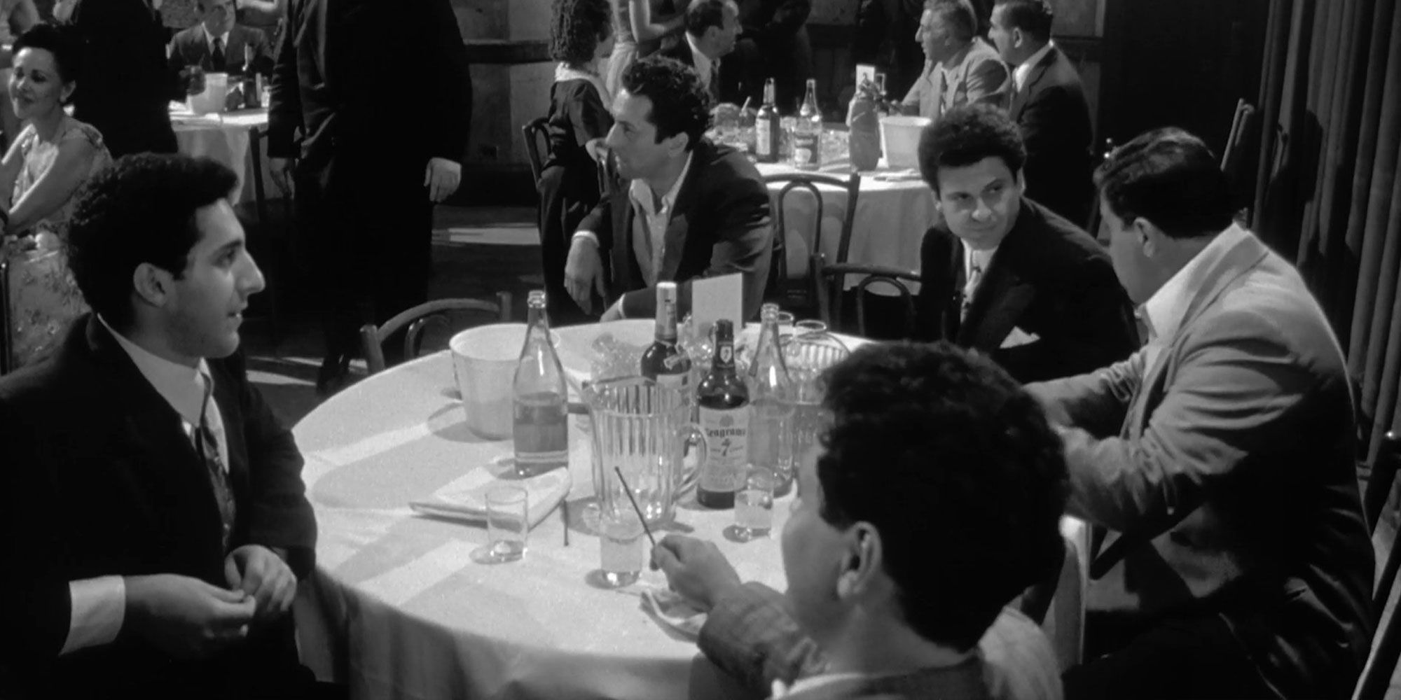 Raging Bull John Turturro, Robert De Niro, Joe Pesci sat at a table