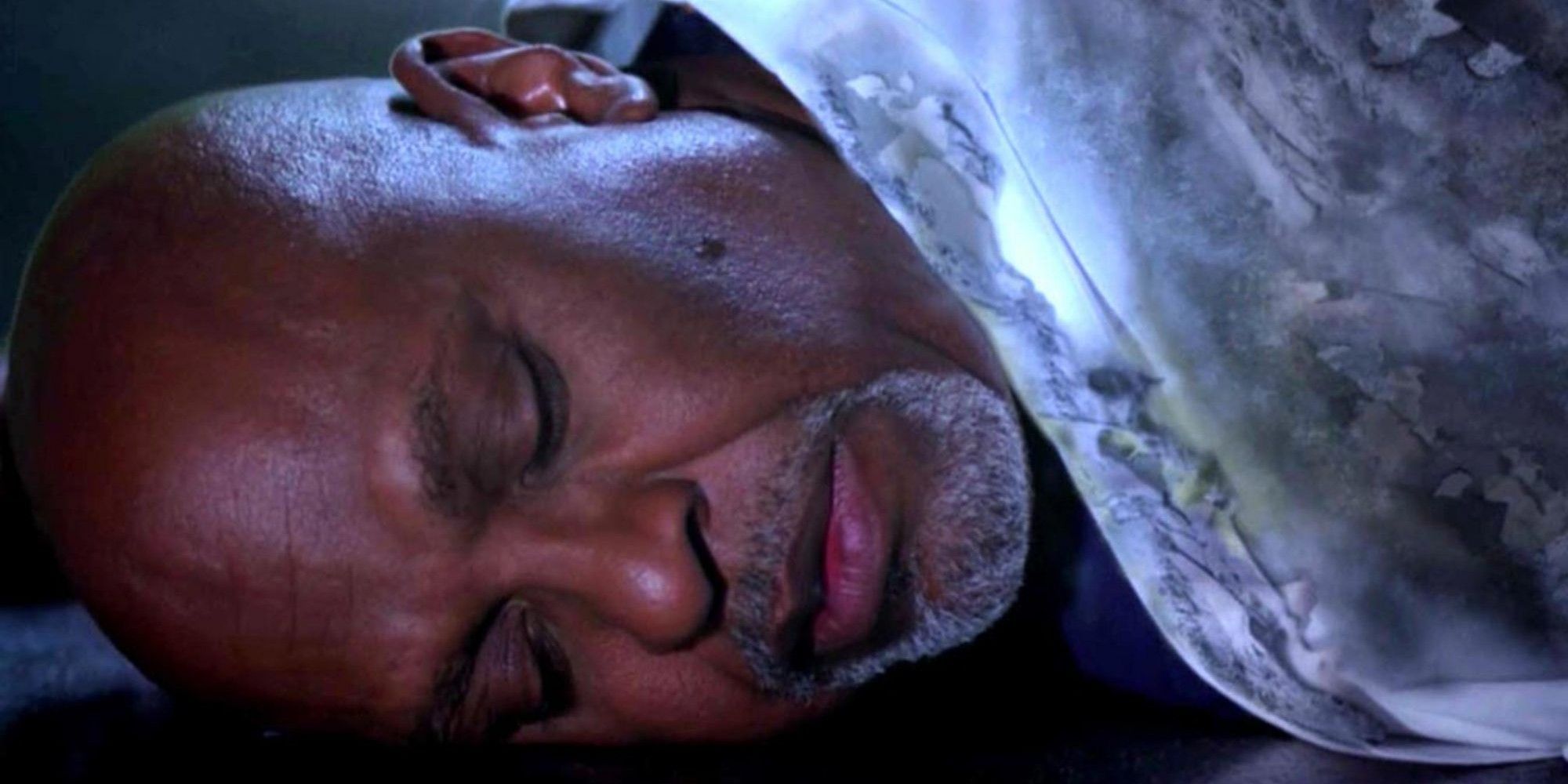 Richard unconscious lying on the floor with a burnt jacket from Grey&rsquo;s Anatomy