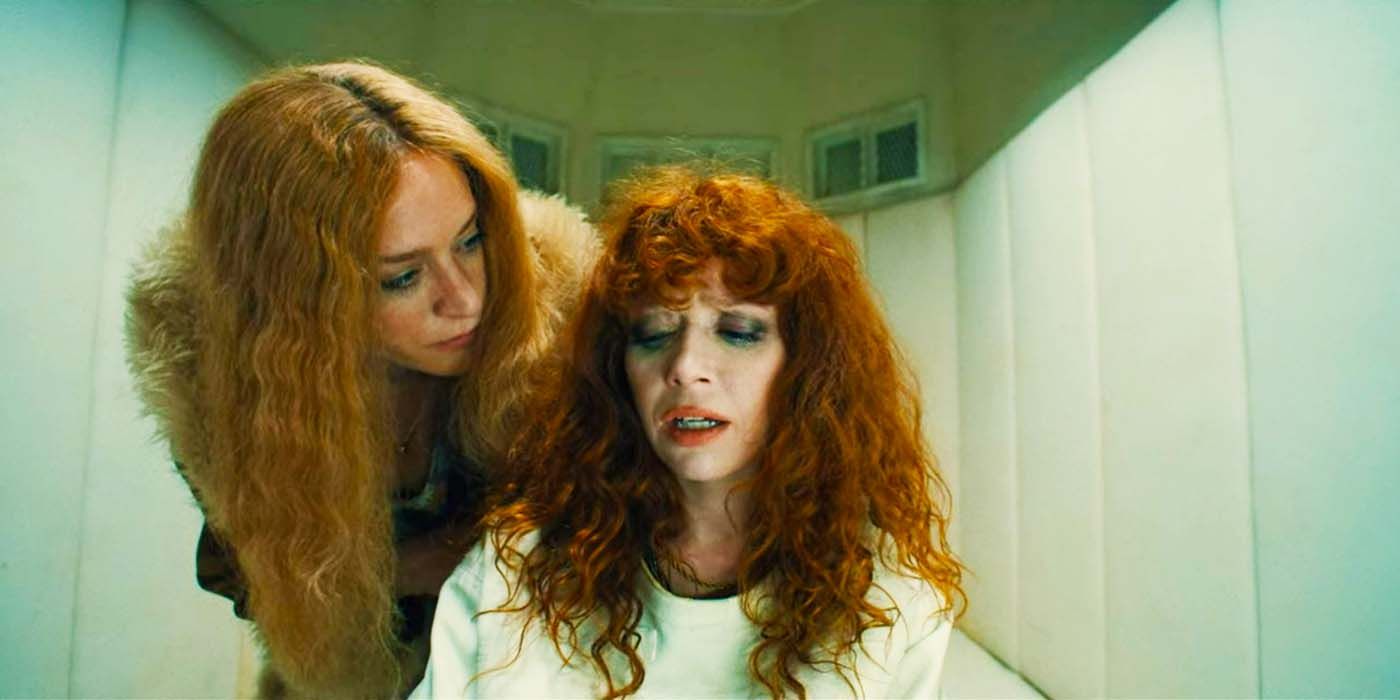 Nora leaning over Nadia in Russian Doll.