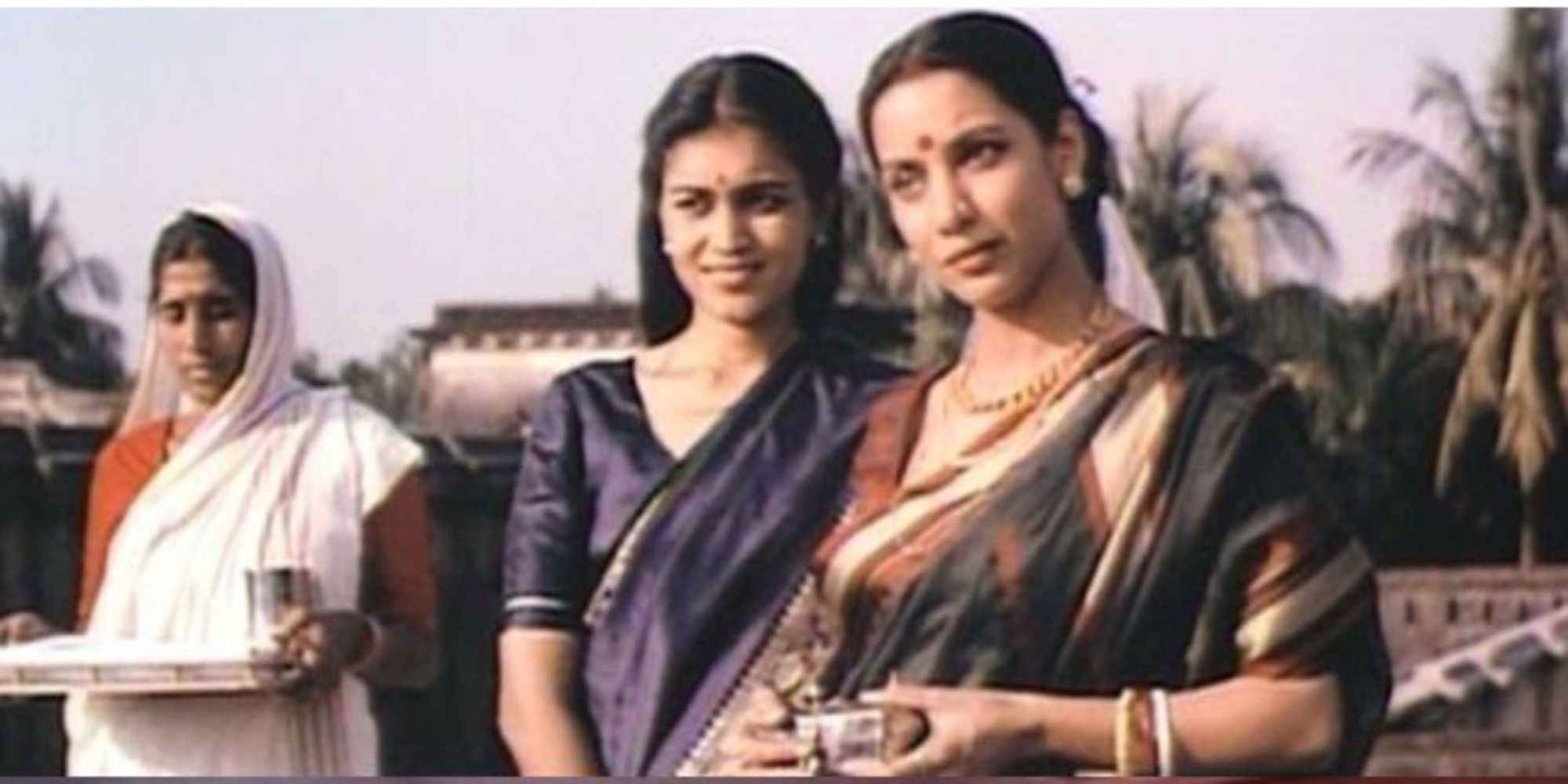Image Of Shabana Azmi In The Bengali Nights Standing With Her Daughter Looking Off Into The Distance