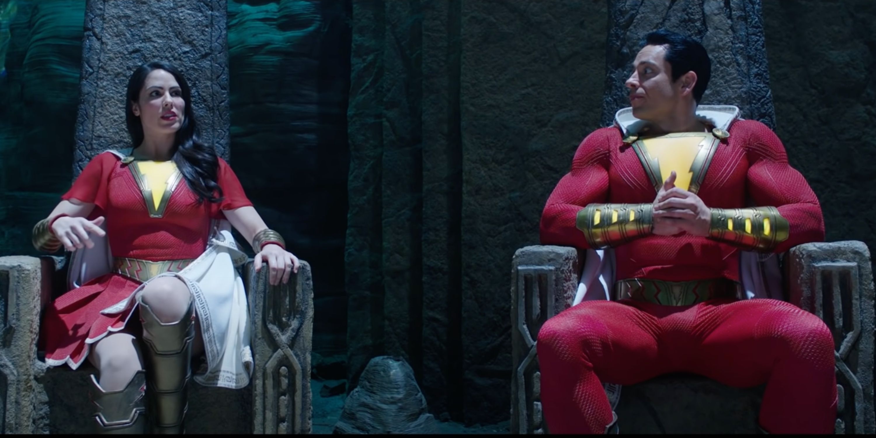 Shazam and the Marvel family on their thrones