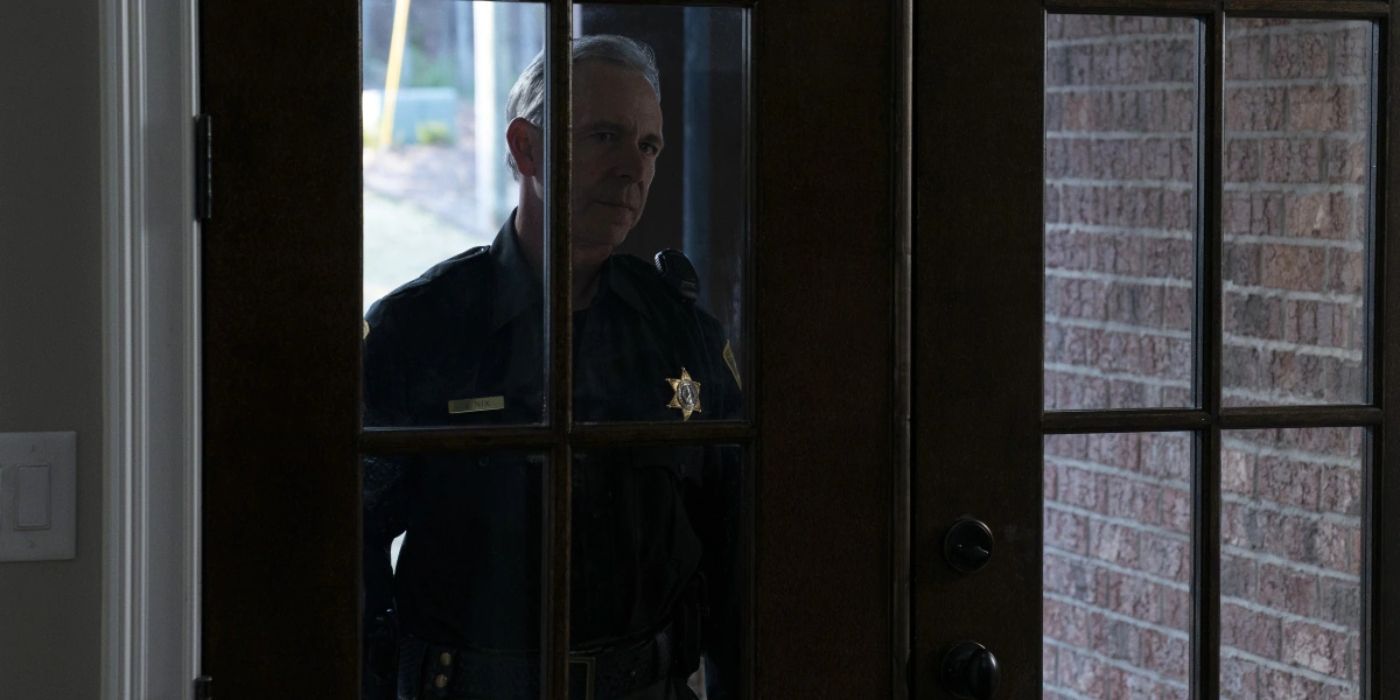 Sheriff John Nix entering a home in Ozark.