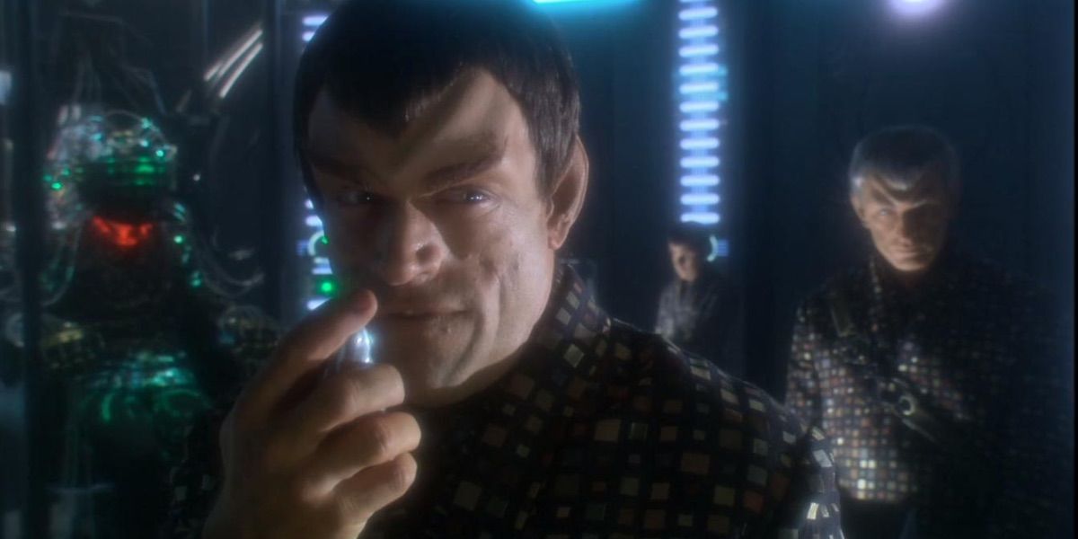 A Romulan makes a gesture from the episode United 