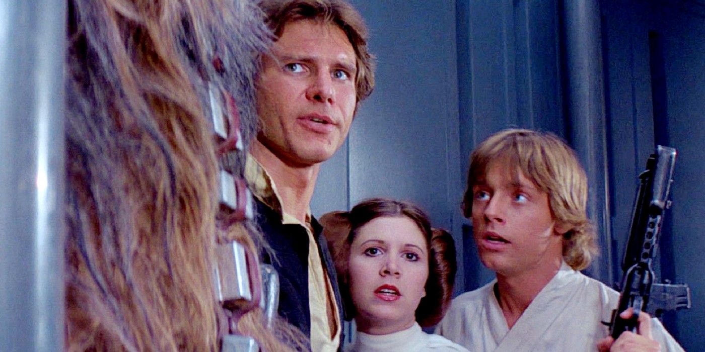 Chewbacca, Han, Leia and Luke stand together in Star Wars: A New Hope