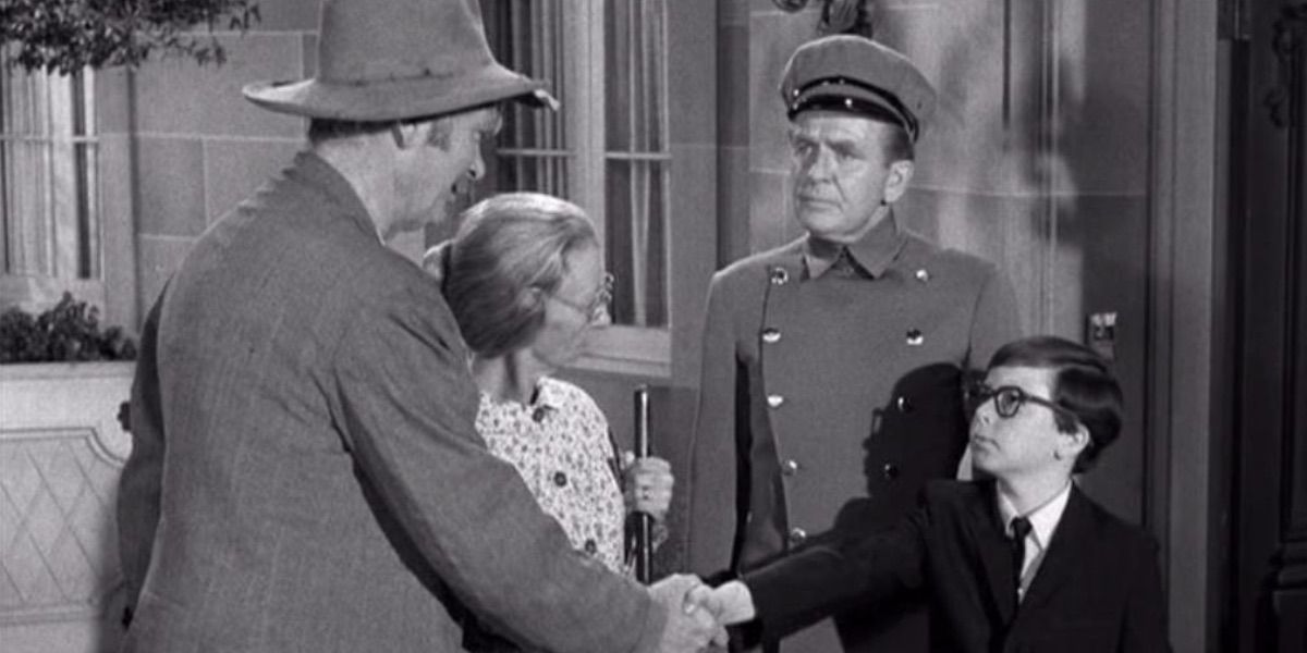 Jed shakes hands with a young boy from The Beverly Hillbillies 