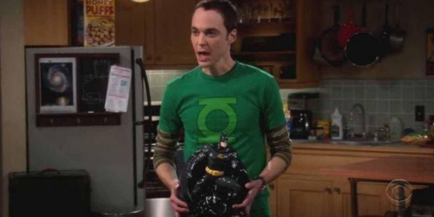 Sheldon holding the Batman cookie jar in TBBT.