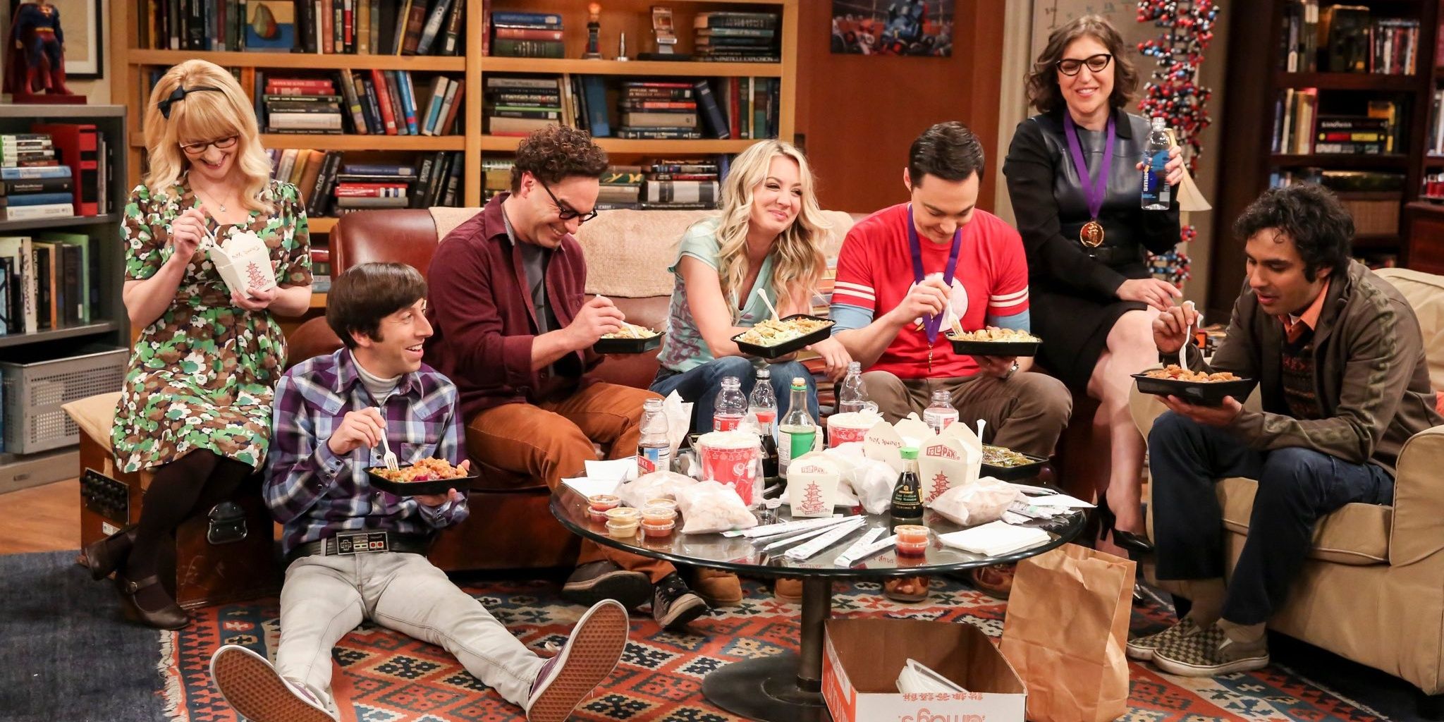 The gang eating food together in The Big Bang Theory