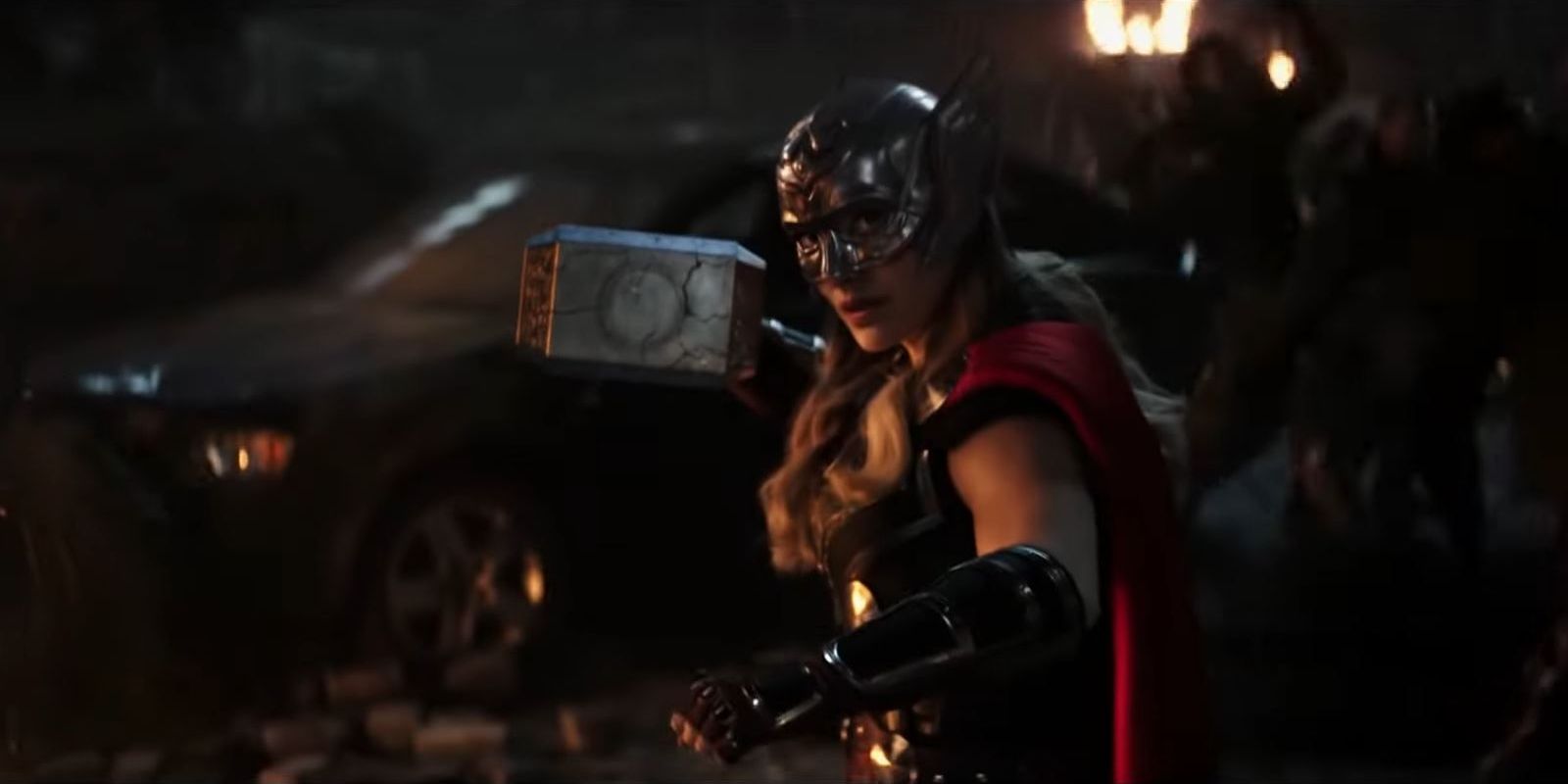 Natalie Portman as Jane Foster in the Mighty Thor armor, holding Mjolnir