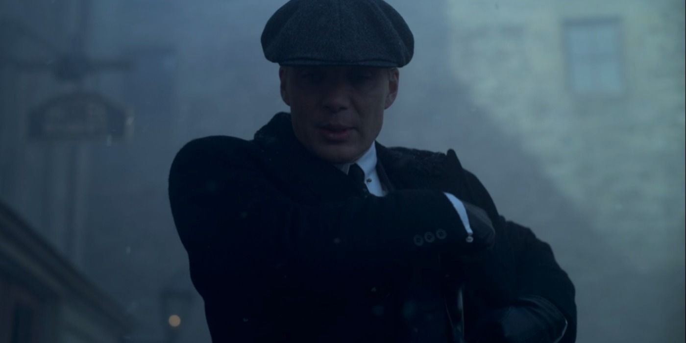Tommy puts his gun away after shooting Michael in the face in Peaky Blinders