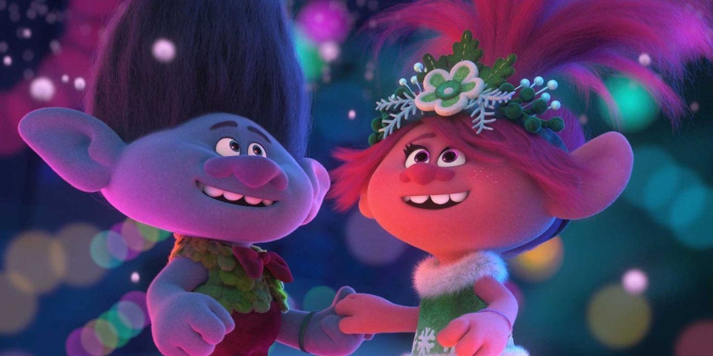 Two characters holding hands in Trolls Holiday In Harmony