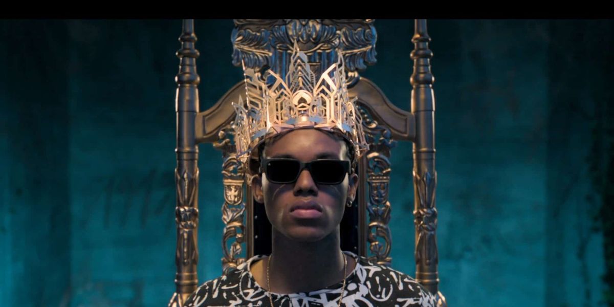 Will from Bel-Air wearing a crown sitting on a throne