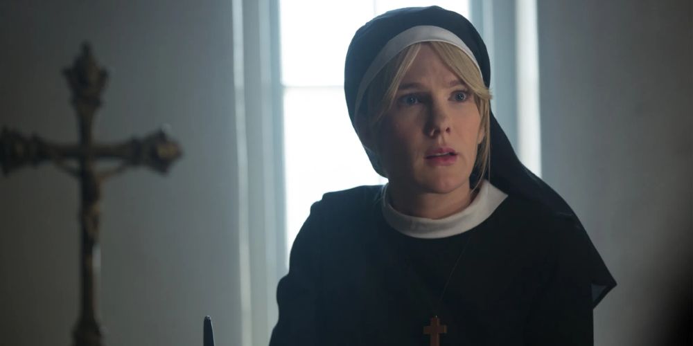 Sister Eunice writes at her desk in American Horror Story