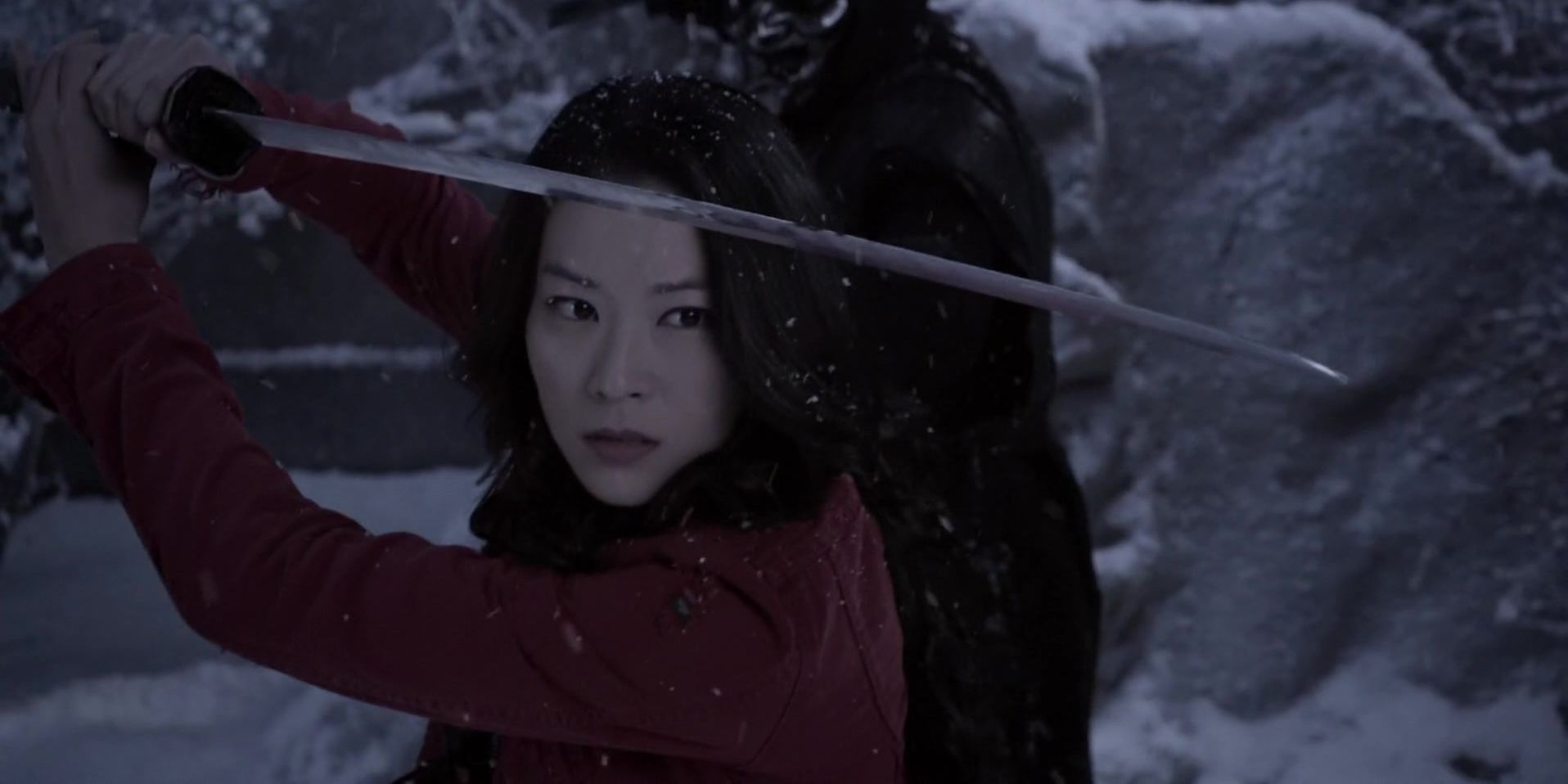 kira holding up her sword in teen wolf