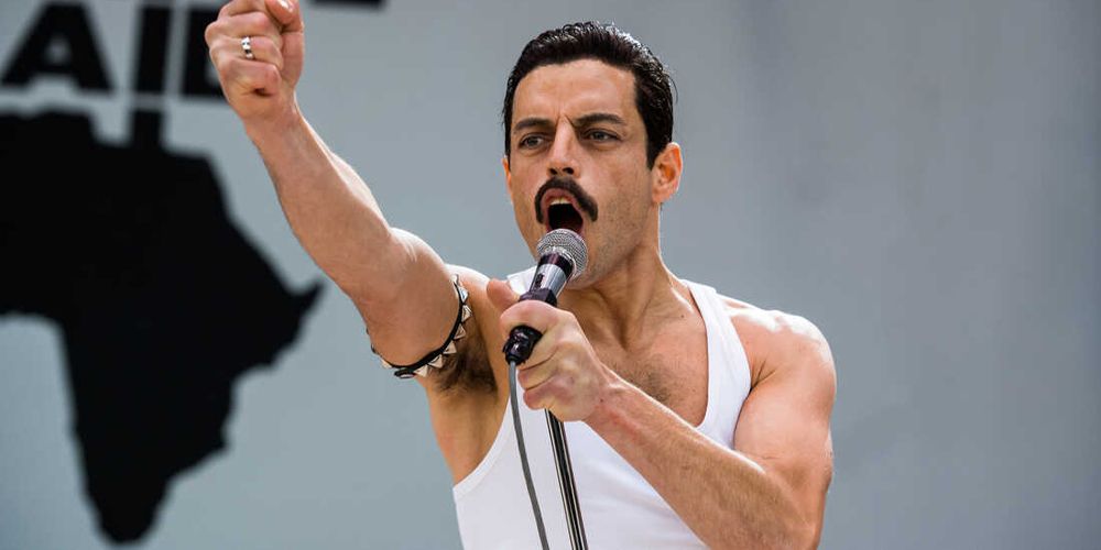 Freddie pumps a fist on stage in Bohemian Rhapsody