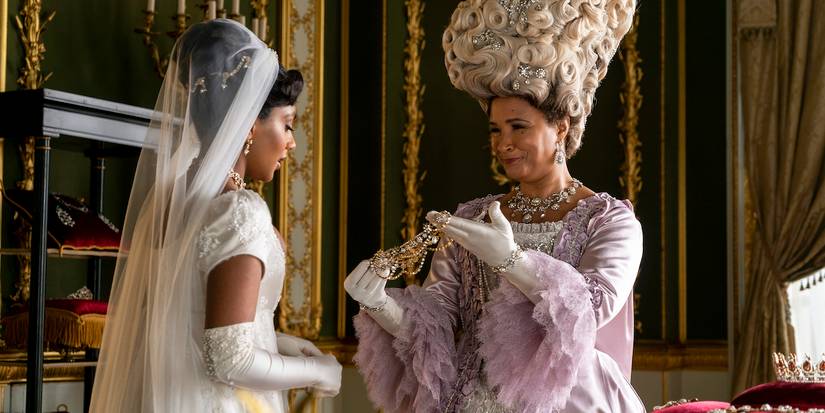 Edwina (Charithra Chandran) in Her Wedding Gown While Queen Charlotte (Golda Rosheuvel) Presents Her with Jewelry in Bridgerton Season 2