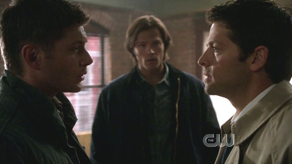 Dean and Cas talking while Sam staring at them