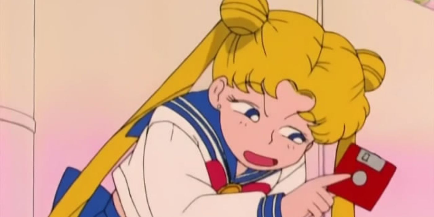 Usagi Tsukino holding a computer floppy disk in Sailor Moon 90s anime