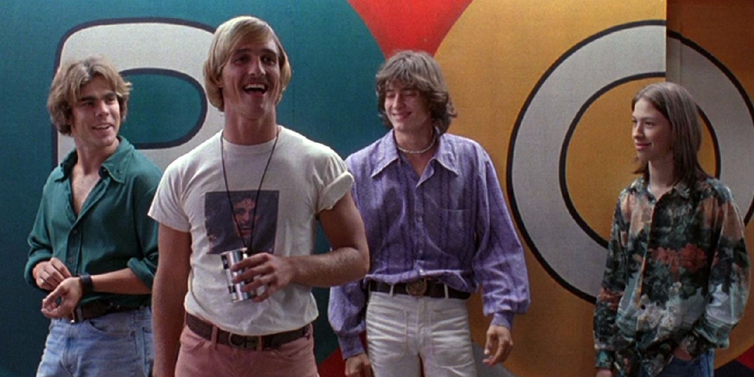 Several men stand in front of a brightly painted wall from Dazed and Confused 