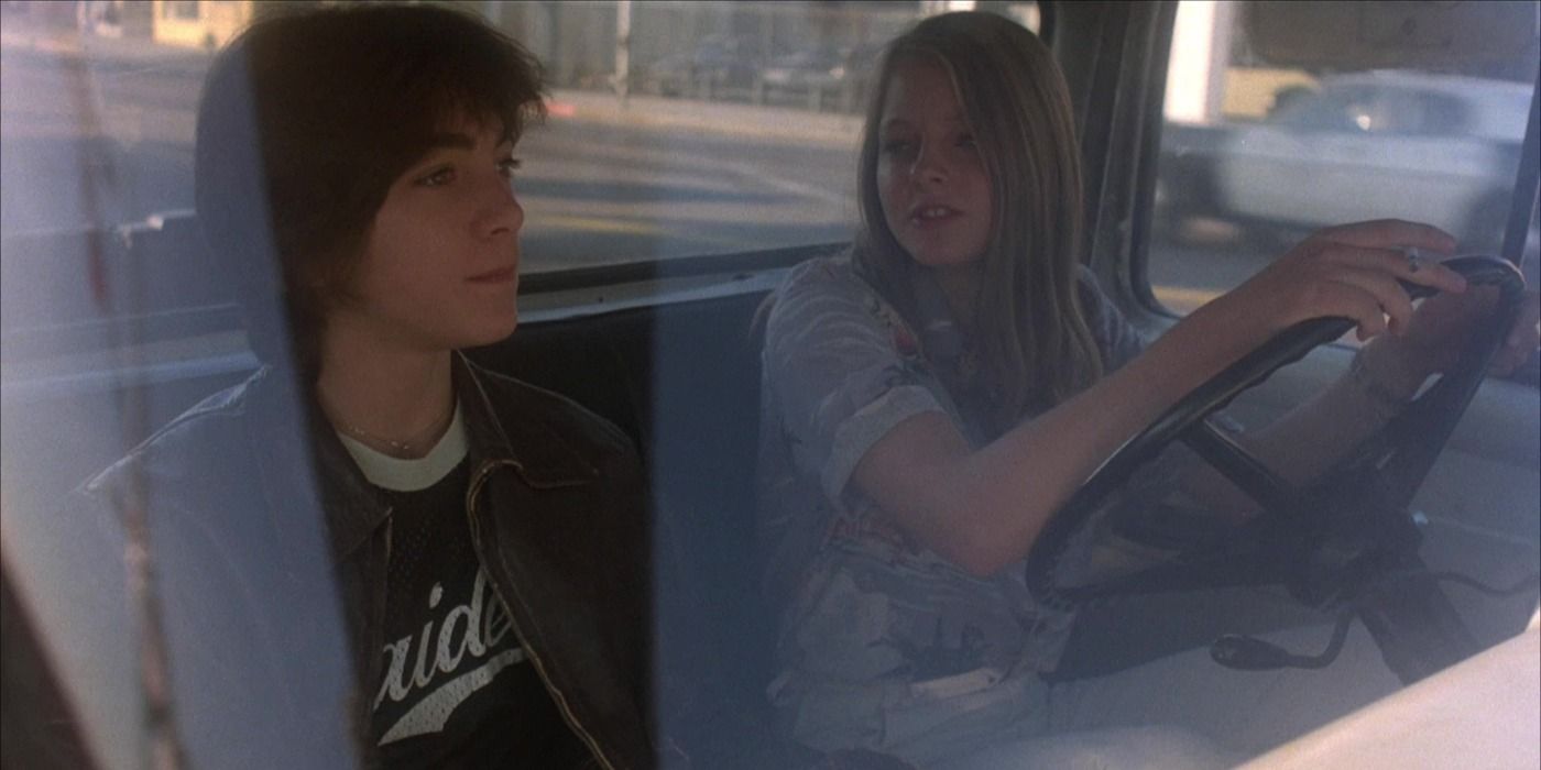 Scott Baio and Jodie Foster driving a car in Foxes.