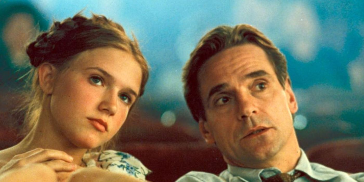 Humbert (Jeremy Irons) and Lolita (Dominique Swain) sitting in a movie theater Lolita.
