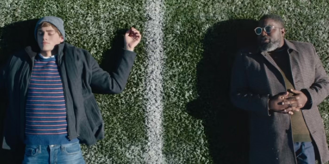 Lil Rel Howery lays on a football field in Clouds.