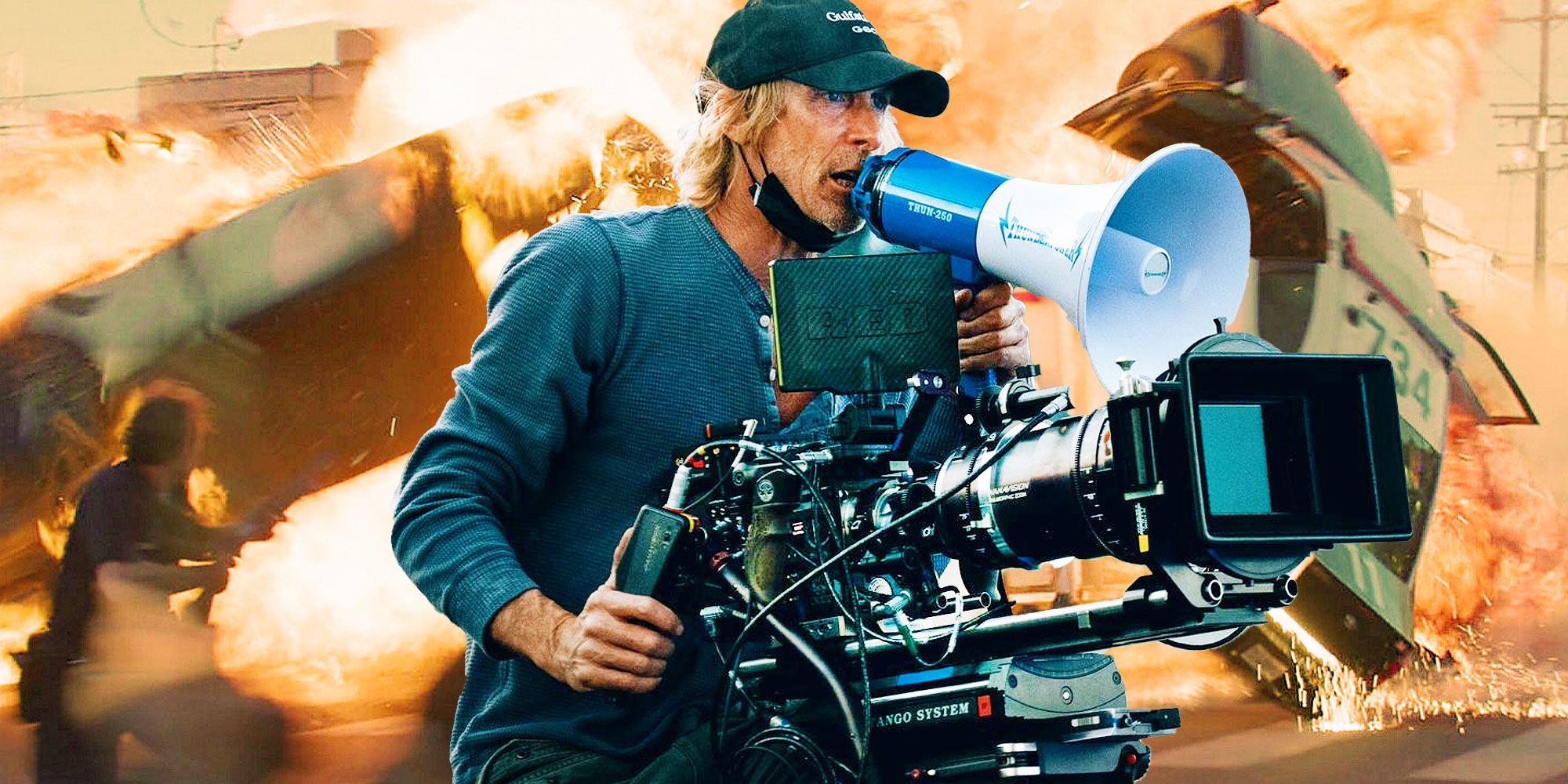 Michael Bay behind a camera over a picture of explosions