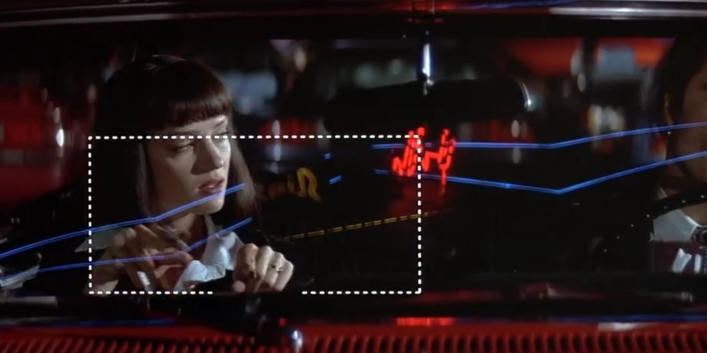 Mia Wallace draws a rectangle in a car as Vincent Vega Watches in Pulp Fiction