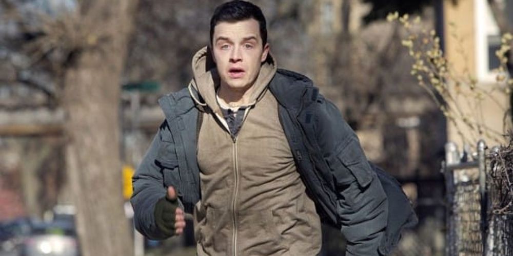 Mickey runs down the street in Shameless