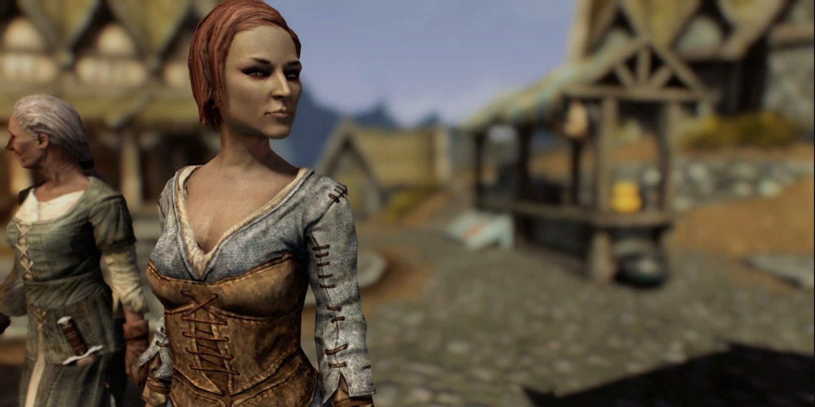 Ysolda standing in Whiterun, looking off to the side on a sunny day in Skryim.