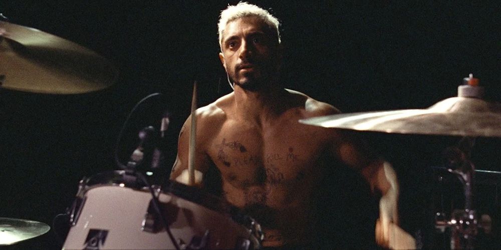Ruben plays drums shirtless in Sound of Metal