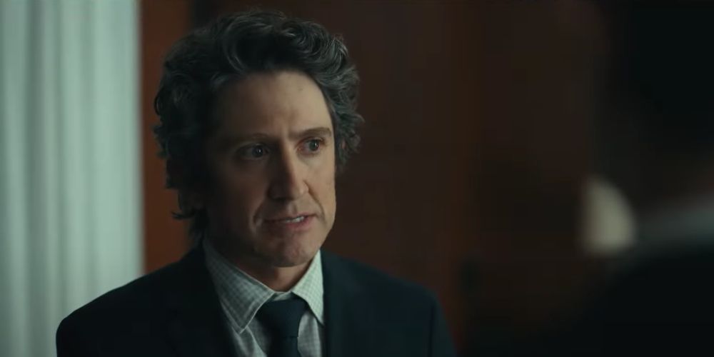 Peter wears a black suit in the office in Super Pumped: The Battle for Uber