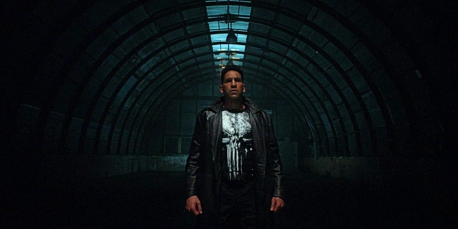 The Punisher walking down a dark bunker