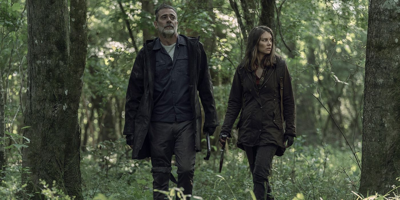 Negan and Maggie walking together in the forest on The Walking Dead.