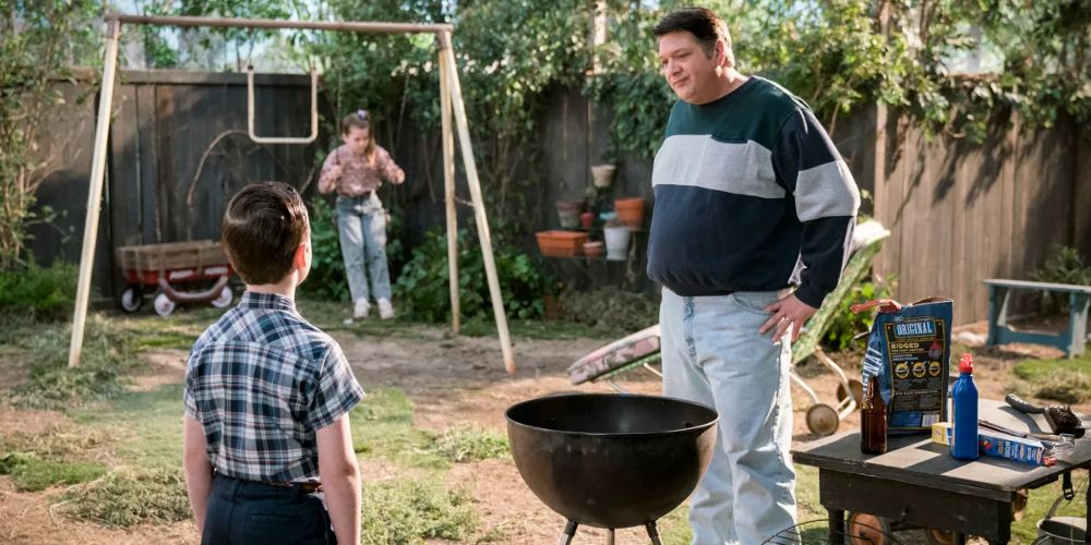 Sheldon and George BBQ outdoors in Young Sheldon