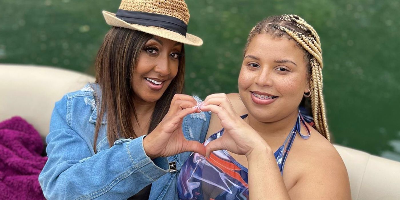 The Family Chantel Winter and Karen Everett making a heart with their hands and smiling