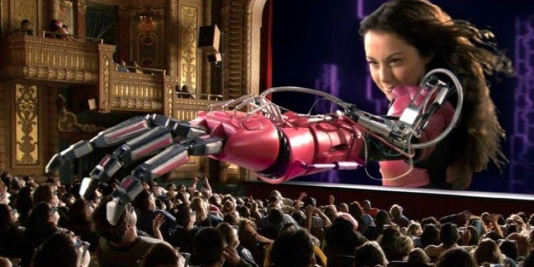 Carmen Cortez reaches out of the theater screen over an audience wearing 3-D glasses in a trailer for &quot;Spy Kids 3-D: Game Over&quot;