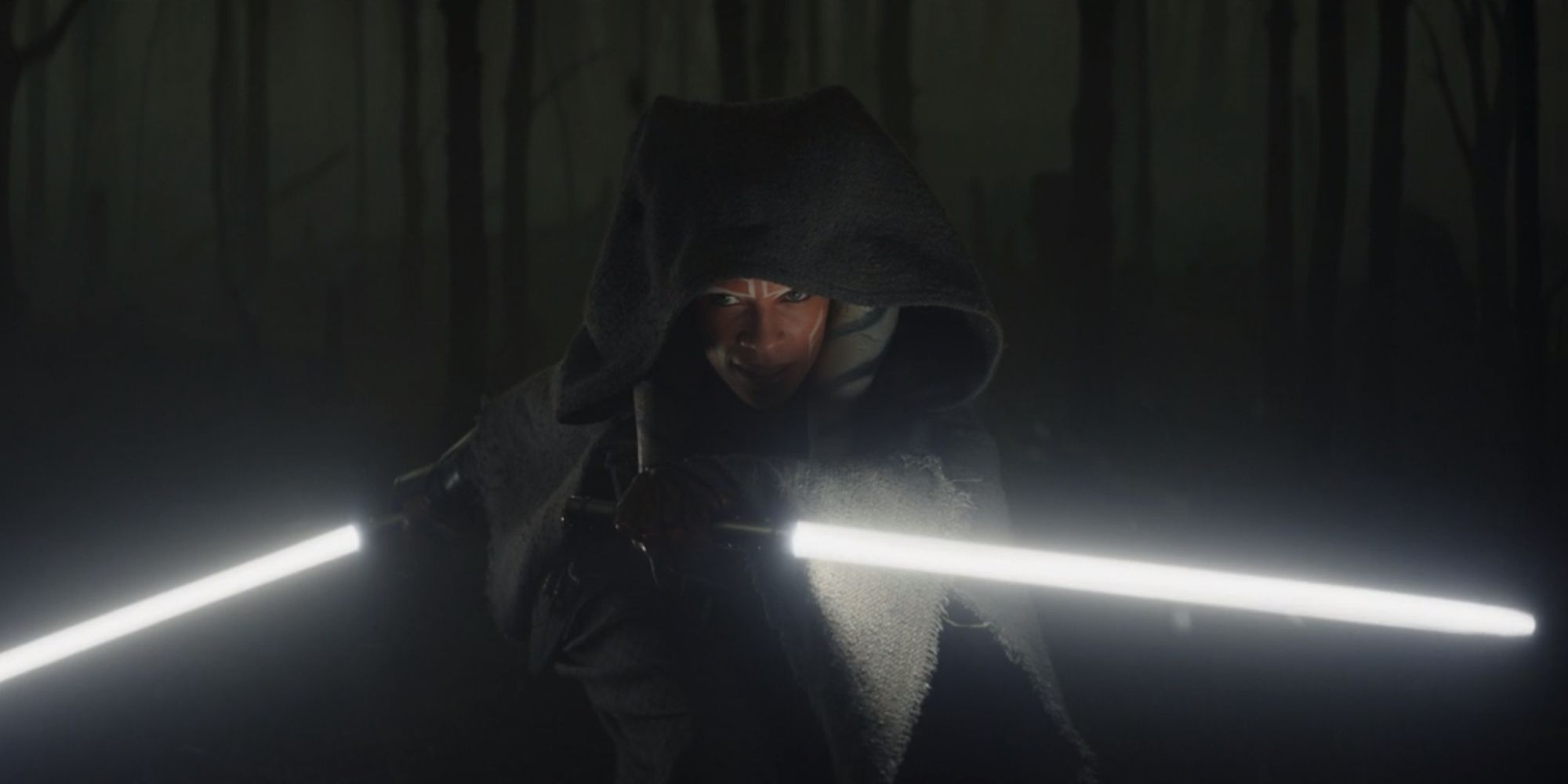 Ahsoka Tano wielding her white lightsabers in the forests of Corvus in The Mandalorian