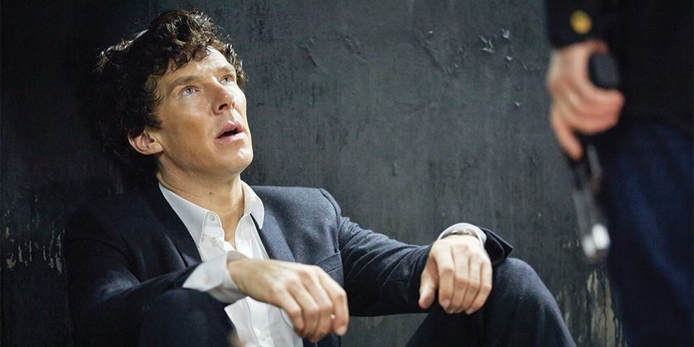 An exhausted Sherlock looking at someone offscreen in the BBC Series