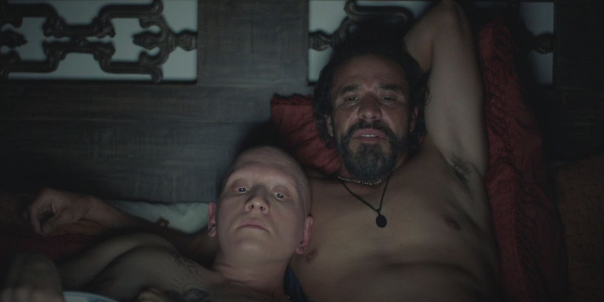 NoHo Hank (Anthony Carrigan) in bed watching TV with Cristobal Sifuentes (Michael Irby) in season 3 of HBO Barry