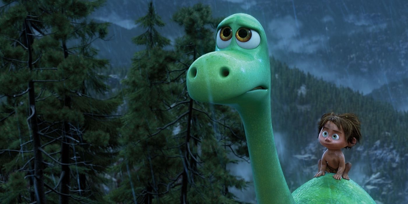Arlo on the back of Spot under the rain in The Good Dinosaur.